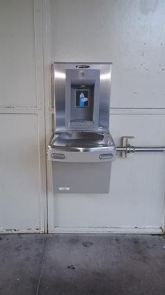 Water fountain with bottle refilling station